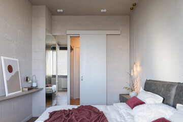 Bedroom in loft interior, bedroom in loft style, bedroom in the sun, bedroom in gray and beige tones