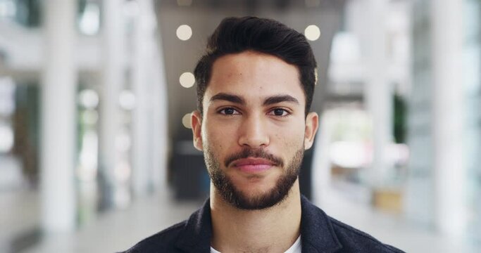 Be confident when pursuing success. 4k video footage of a young handsome businessman in a modern office.