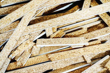 Chipboard trimmings. Industrial waste of furniture production. Close-up