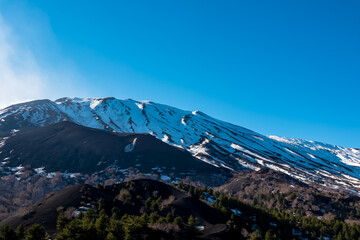 Panoramic view on solidified lava, ash, pumice fields of erupted Sartorio crater. Landscape dark...