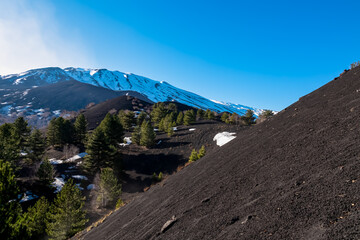 Panoramic view on solidified lava, ash, pumice fields of erupted Sartorio crater. Landscape dark...