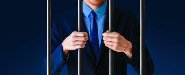Politician behind bars in prison cell. Wide banner background.