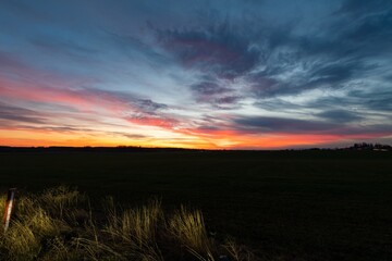 Naklejka na ściany i meble sunset over a field