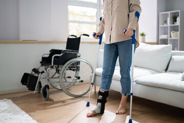Fototapeta na wymiar Hurt Leg Using Crutches Near Wheelchair