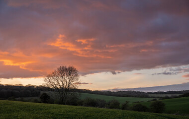 Fototapeta na wymiar Colourful orange sunset sky over the south downs near Lewes East Sussex, south east England