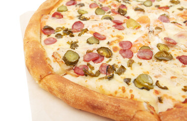 Pizza with sausage and cucumbers on a white background. Close-up