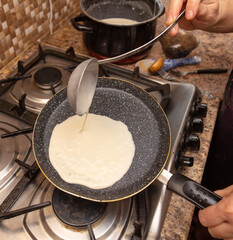 Pancakes from liquid dough are fried