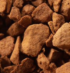 Instant coffee granules as background.