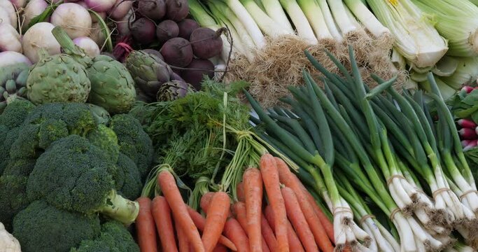 Fresh vegetables on stalls in a southern France market.