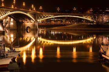 The Margaret Bridge and its lights as reflected by the Danube river
