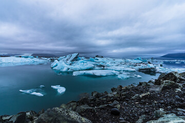 Jokulsarlon lagoon icebergs under cloudy sky