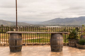 table counter made with wine barrels and valley in the background in Mexico 