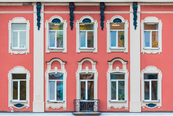 Many windows in a row on the facade of the urban historic apartment building front view, Saint Petersburg, Russia  © dr_verner
