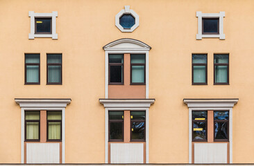 Many windows in a row on the facade of the modern urban apartment building front view, Krasnaya Polyana, Sochi, Krasnodar Krai, Russia
