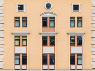 Many windows in a row on the facade of the modern urban apartment building front view, Krasnaya Polyana, Sochi, Krasnodar Krai, Russia
