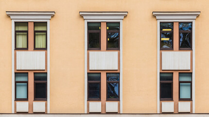 Many windows in a row on the facade of the modern urban apartment building front view, Krasnaya Polyana, Sochi, Krasnodar Krai, Russia
