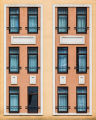 Many windows in a row on the facade of the modern urban apartment building front view, Krasnaya Polyana, Sochi, Krasnodar Krai, Russia

