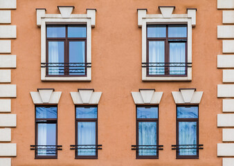 Several windows in a row on the facade of the modern urban apartment building front view, Krasnaya Polyana, Sochi, Krasnodar Krai, Russia
