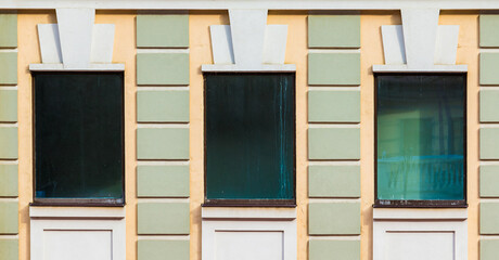 Three windows in a row on the facade of the modern urban apartment building front view, Krasnaya...