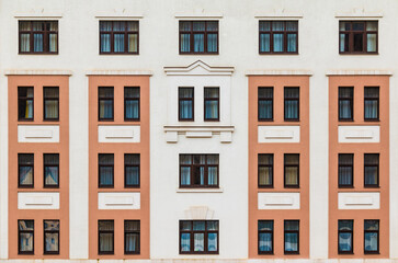 Many windows in a row on the facade of the modern urban apartment building front view, Krasnaya Polyana, Sochi, Krasnodar Krai, Russia
