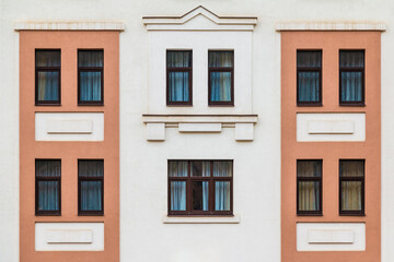 Many windows in a row on the facade of the modern urban apartment building front view, Krasnaya Polyana, Sochi, Krasnodar Krai, Russia
