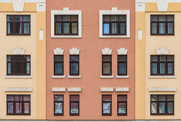 Many windows in a row on the facade of the modern urban apartment building front view, Krasnaya Polyana, Sochi, Krasnodar Krai, Russia

