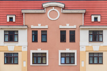 Many windows in a row on the facade of the modern urban apartment building front view, Krasnaya Polyana, Sochi, Krasnodar Krai, Russia
