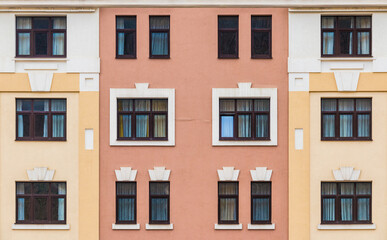 Many windows in a row on the facade of the modern urban apartment building front view, Krasnaya...