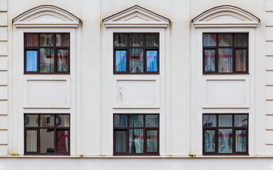 Several windows in a row on the facade of the modern urban apartment building front view, Krasnaya Polyana, Sochi, Krasnodar Krai, Russia
