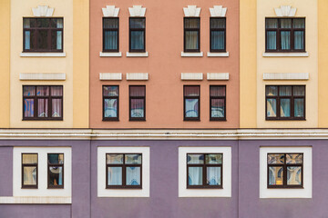 Many windows in a row on the facade of the modern urban apartment building front view, Krasnaya Polyana, Sochi, Krasnodar Krai, Russia
