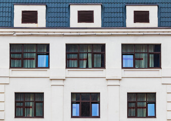 Several windows in a row on the facade of the modern urban apartment building front view, Krasnaya Polyana, Sochi, Krasnodar Krai, Russia
