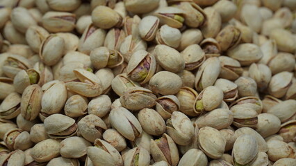 Pistachio Nuts, pistacia vera, Dry Fruits. Close-up pile of beans it has a white nut shell dry and hard of Pistachio
