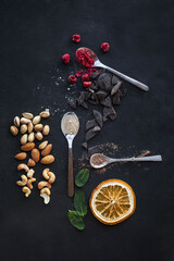 Fototapeta na wymiar Ingredients for chocolate on a dark background top view