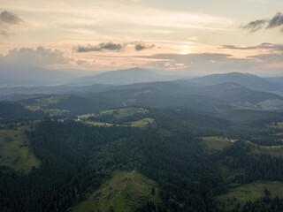 Sunset over the mountains in the Ukrainian Carpathians. Evening. Aerial drone view.