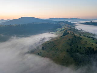Morning fog in the Ukrainian Carpathians. Aerial drone view.