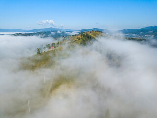 Morning fog in the Ukrainian Carpathians. Aerial drone view.