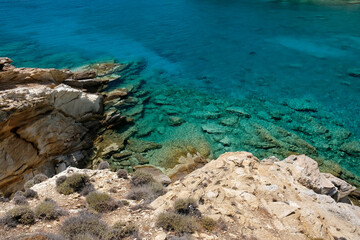 Fototapeta premium View of the most amazing turquoise beach of Tripiti, on a beautiful day on the island of Ios Greece