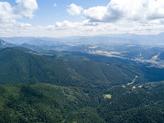 High mountains of the Ukrainian Carpathians in sunny weather. Aerial drone view.