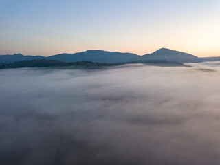 Morning fog in the Ukrainian Carpathians. Aerial drone view.