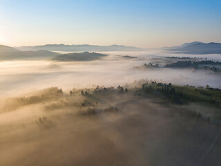 Morning fog in the Ukrainian Carpathians. Aerial drone view.