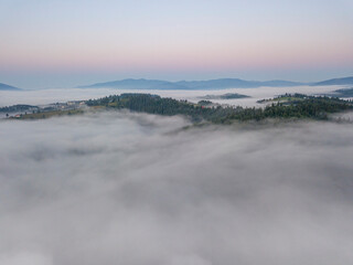 Morning fog in the Ukrainian Carpathians. Aerial drone view.