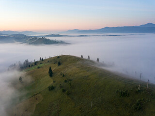 Morning fog in the Ukrainian Carpathians. Aerial drone view.