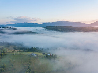 Morning fog in the Ukrainian Carpathians. Aerial drone view.