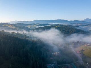 Morning fog in the Ukrainian Carpathians. Aerial drone view.