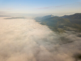 Sunrise over the fog in the Ukrainian Carpathians. Aerial drone view.