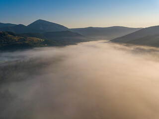 Morning fog in the Ukrainian Carpathians. Aerial drone view.