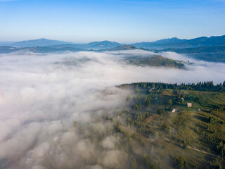 Morning fog in the Ukrainian Carpathians. Aerial drone view.