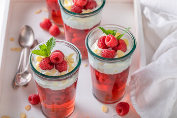 Fresh red jelly as a fruit dessert with cream.