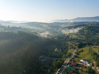 Green mountains of Ukrainian Carpathians in summer. Sunny day. Aerial drone view.