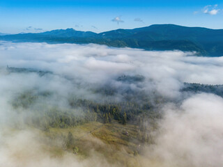 Foggy summer morning in the Ukrainian Carpathians. Aerial drone view.